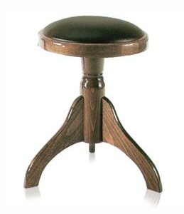A wooden stool with a black seat and three legs.