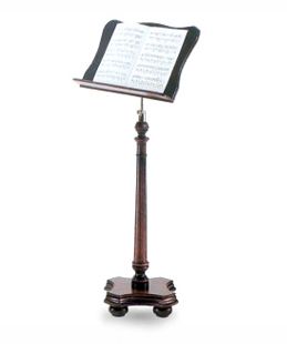 A music stand with a metal holder on top of it.