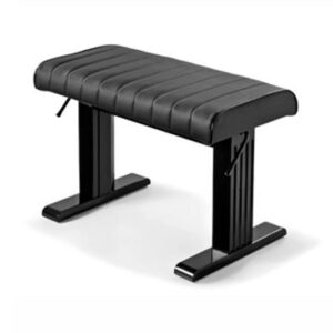 A bench with black leather seat and metal legs.